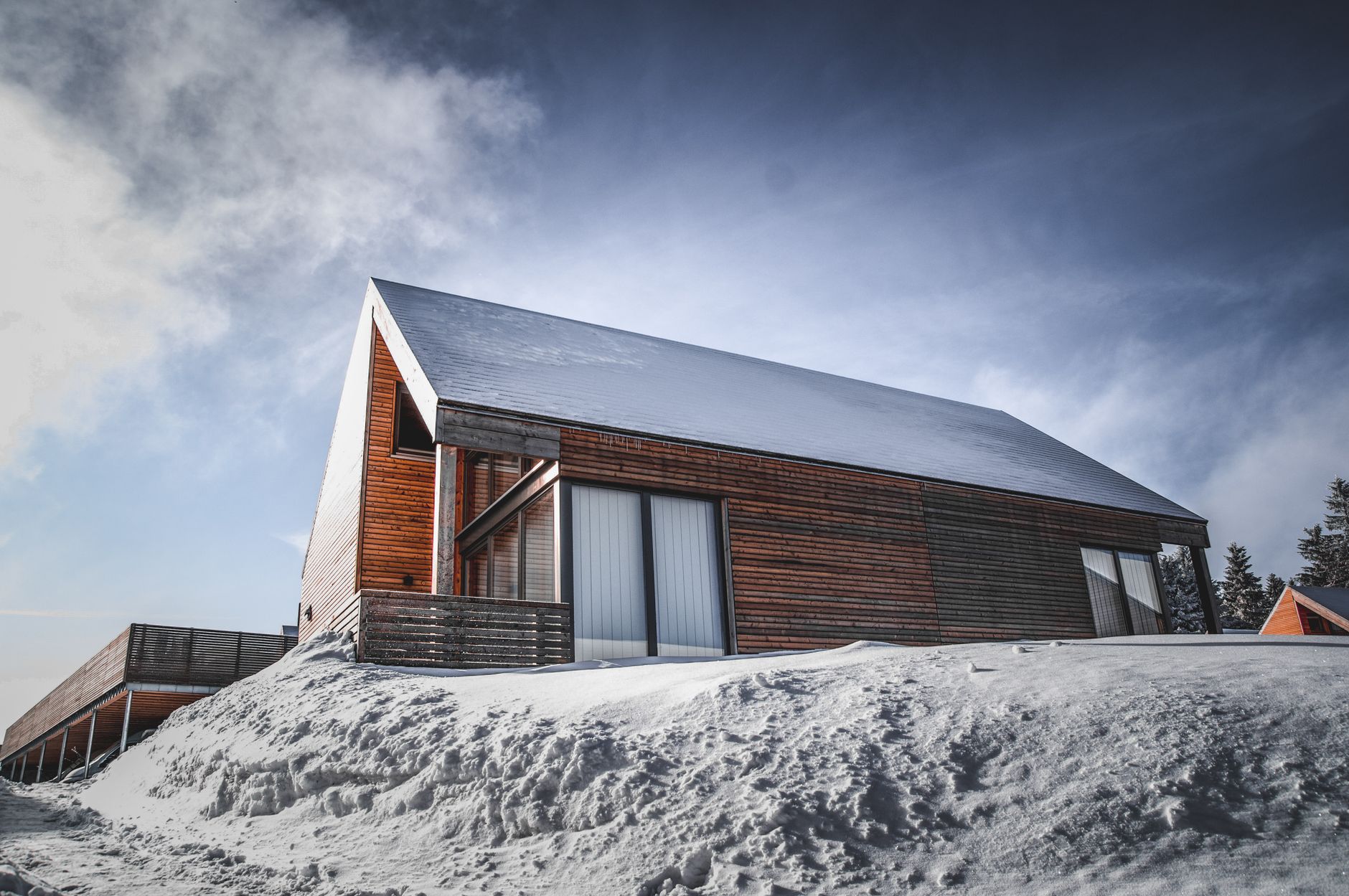 High end alpine lodging with modern wood and glass structure
